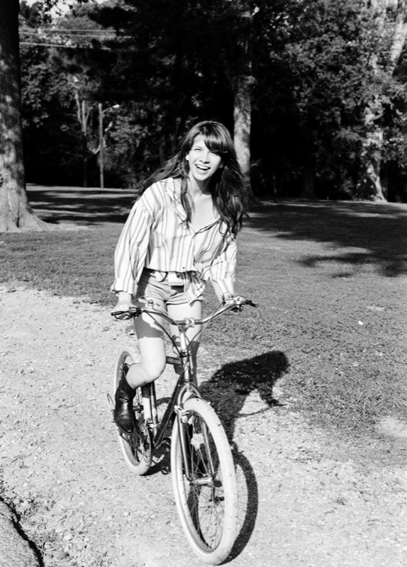 Black and white candid portrait on a bike