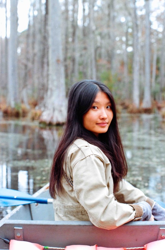 Senior portrait in a canoe on the water