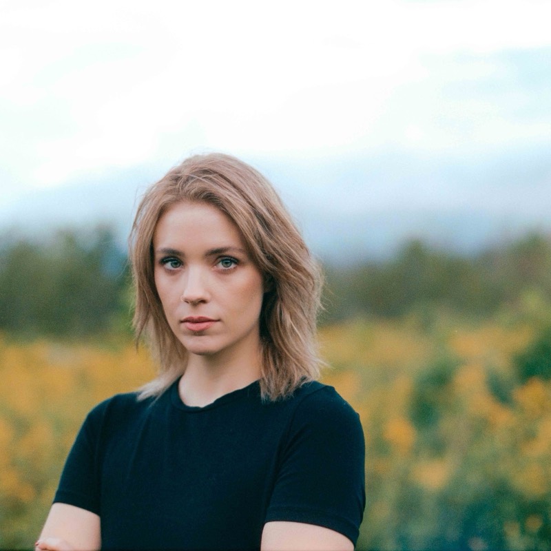 Editorial senior portrait in a goldenrod field
